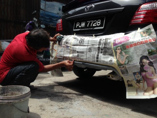 sanding process on car body kit using sandpapers with water