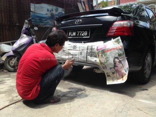 spraying the paint on the car's body kits 2