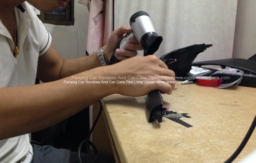 Heating the Toyota Vios Interior Trim with Carbon Fiber Trim using hair dryer 3