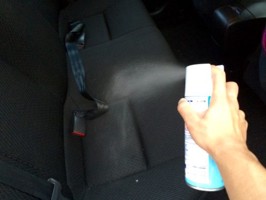 Spray the Lysol Disinfection Spray on the passenger seats 2