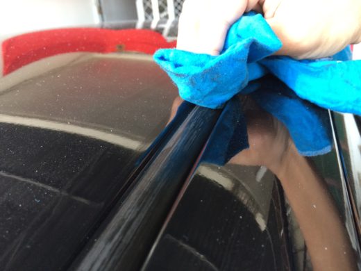 Application of the Armorall Protectant gel on the car roof seal rubber