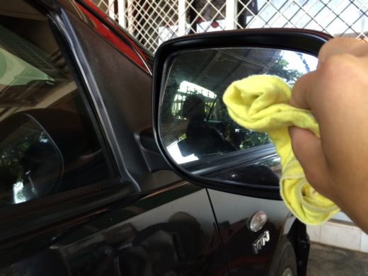 Scrub on the side mirror with cloth and some force