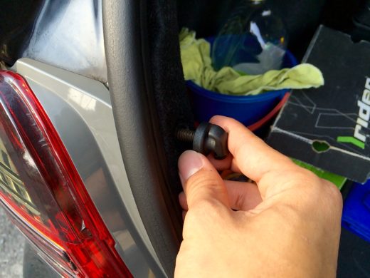 Remove the screw clip in the car boot