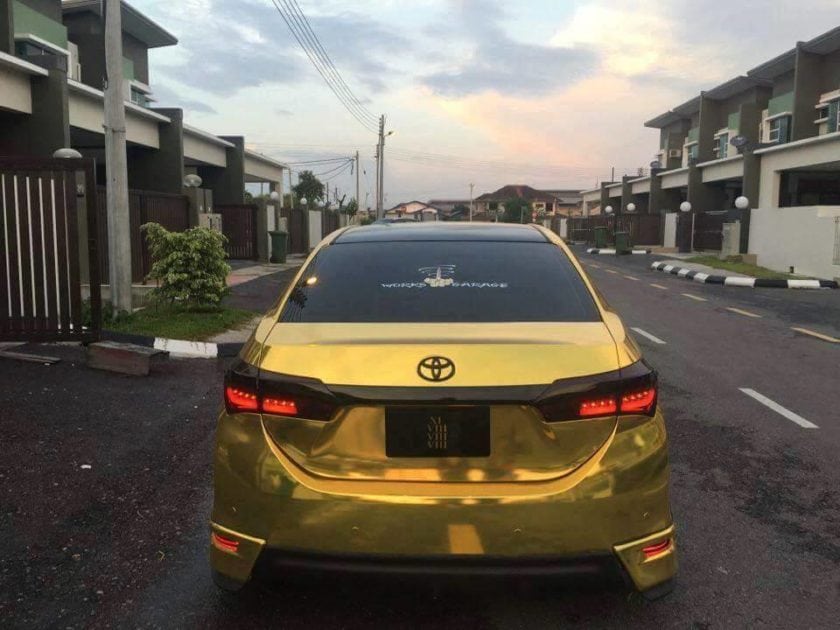 Backview of Gold Toyota Altis