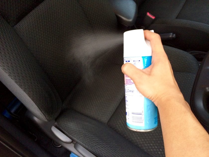 Spray the Lysol Disinfection Spray on the driver seat