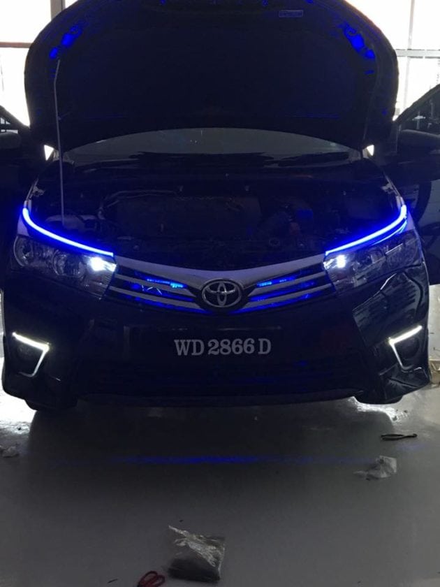 Front view of Black Toyota Altis with Blue DLR LEDs