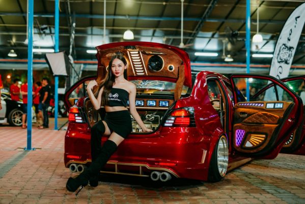 Extremely Mod Red Vios with Asian Girl