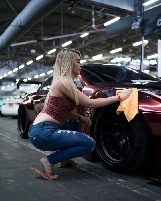 Babe cleaning the car hood