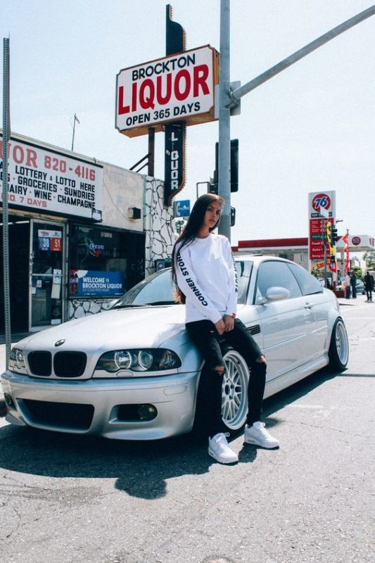 Sunny day with white BMW and girl